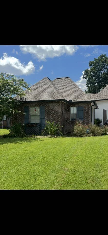 Freshly mowed and edged residential lawn in the Ascension Parish area