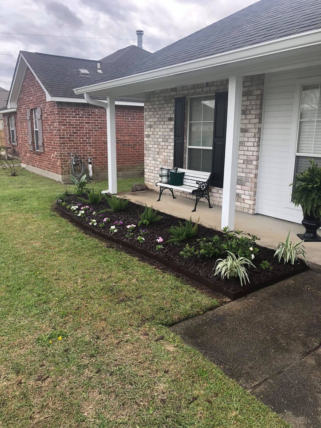 Landscape bed with fresh mulch and flowers
