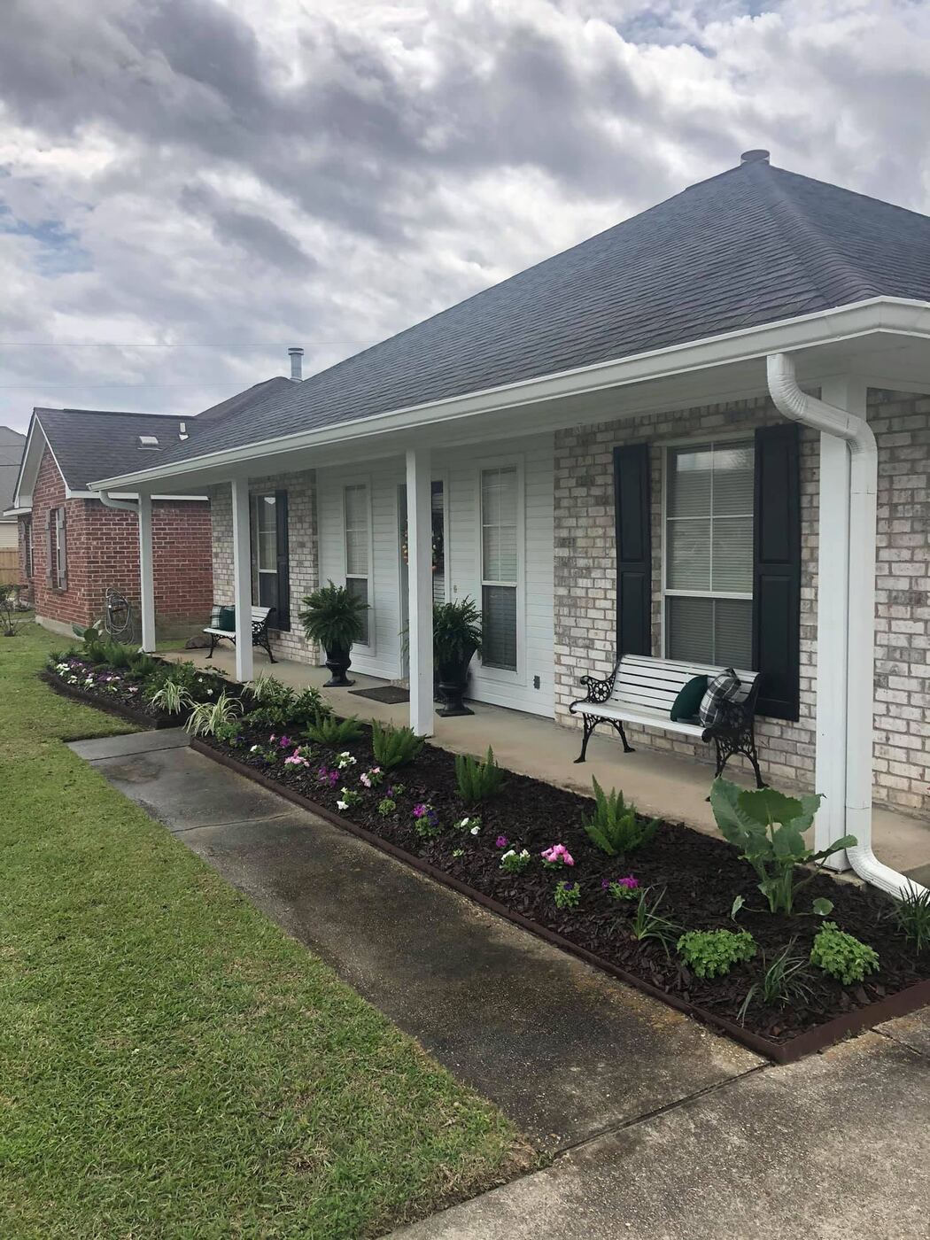 Landscape bed with fresh mulch and flowers