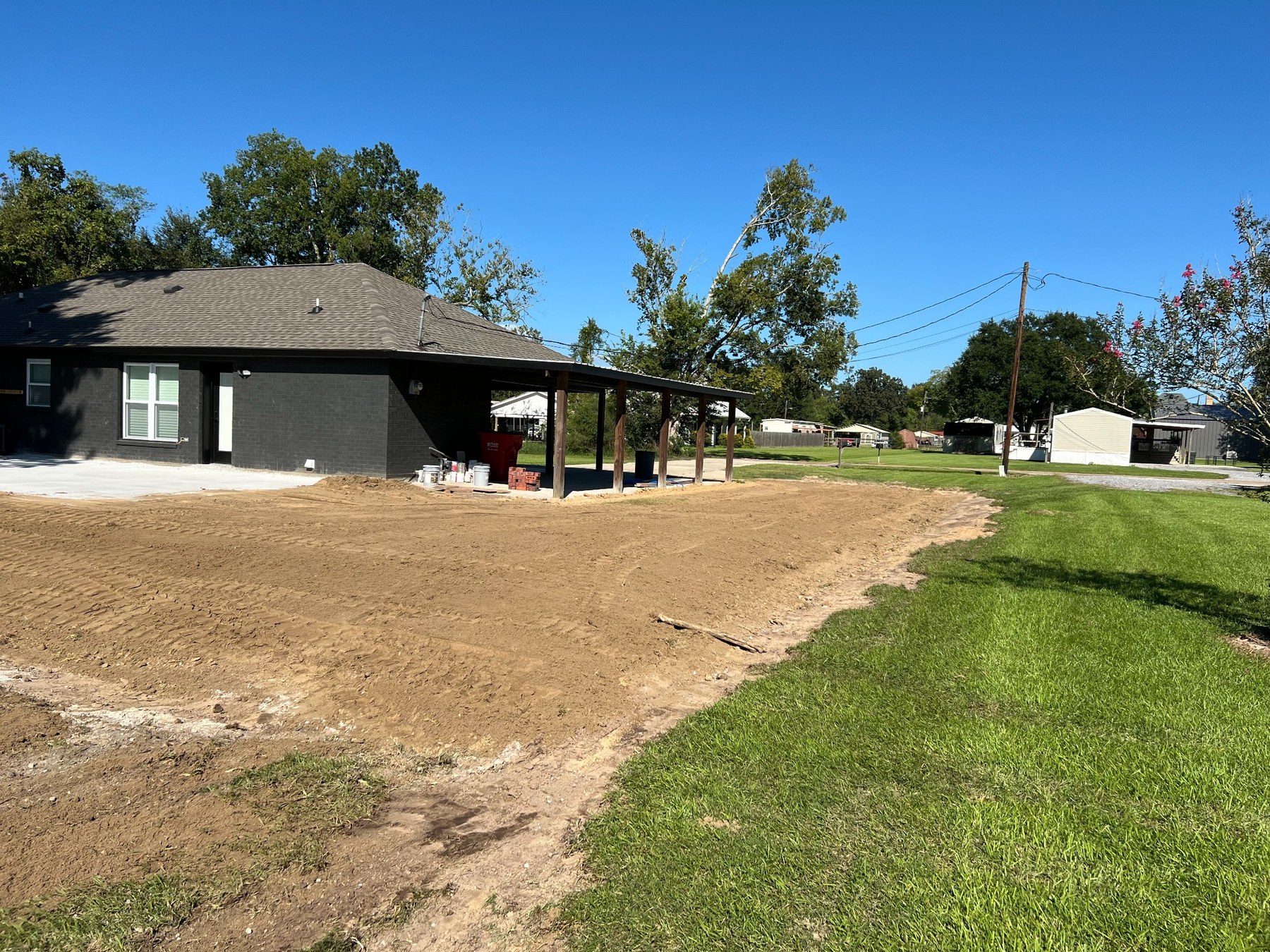 Graded residential property with finish work underway