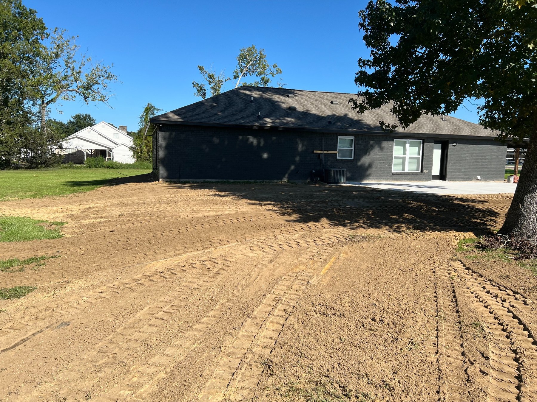 Fresh grading pass across a residential property